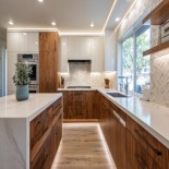 L-Shaped Contemporary Kitchen Design with Walnut Base and Geometric Backsplash